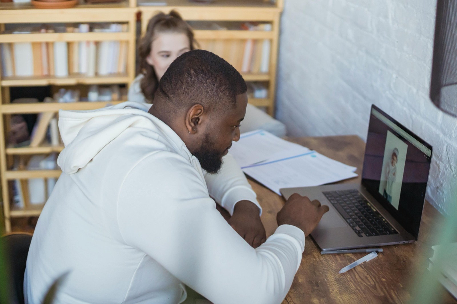Entrepreneur using a laptop for online reseller API automation